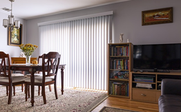 Renter's insurance post image, shows interior of apartment entertainment center and dining area.